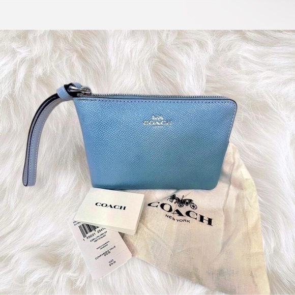 Coach Handbags - Coach Sky Blue Wristlet NWT and Dust bag.